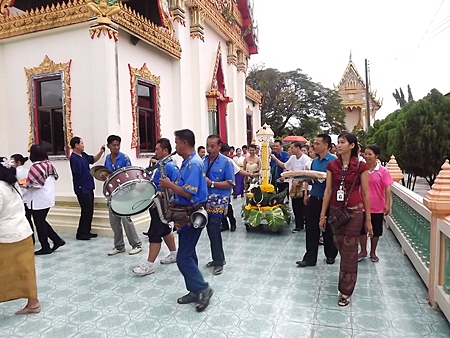 The Diana Group and members of the Press Association of Pattaya celebrate the start of Buddhist Lent by offering candles and supplies to monks at local temples.